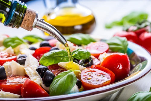 What works best to keep cardiovascular risk factors low, a high fat diet, a Mediterranean diet or a high carbohydrate low fat diet?